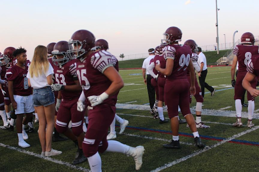 Players in uniform excited to take the field for the first game of the season 