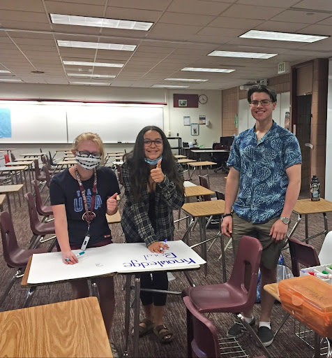 Laura Tisher, Leyla Castillo, and Malachi Mook making a poster for Knowledge Bowl