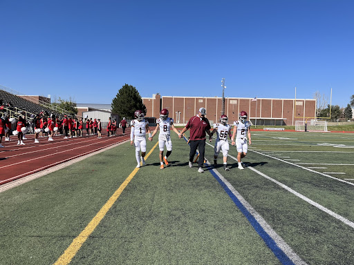 Captains walk out for the coin toss. 