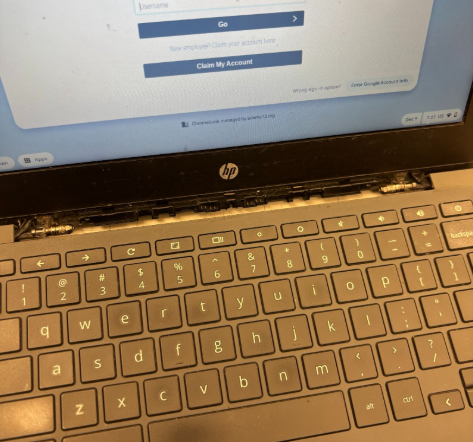 Student chromebook with the center piece missing after it accidentally came off. The student has not felt the need to take the device for repairs due to how it still remains operational.