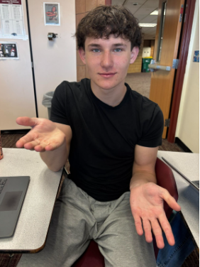 Image of Michael Harold about to perform the famous “6-7” hand movements.