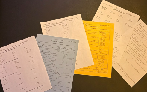 A pile of various homework assignments. 
